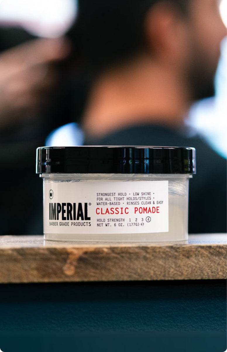 A jar of Classic Pomade on a barber station