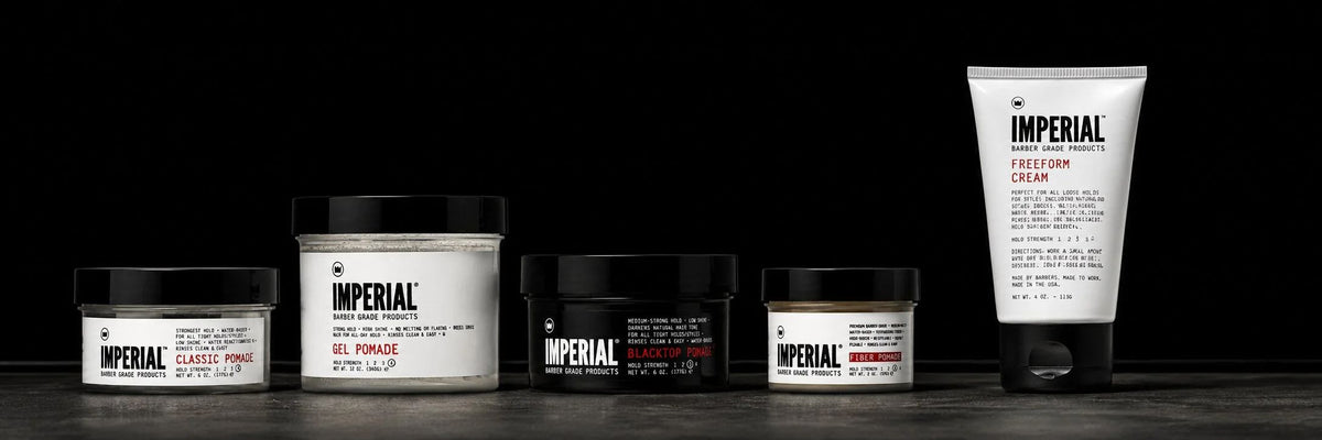 Imperial pomades and Freeform Cream lined up on a dark surface